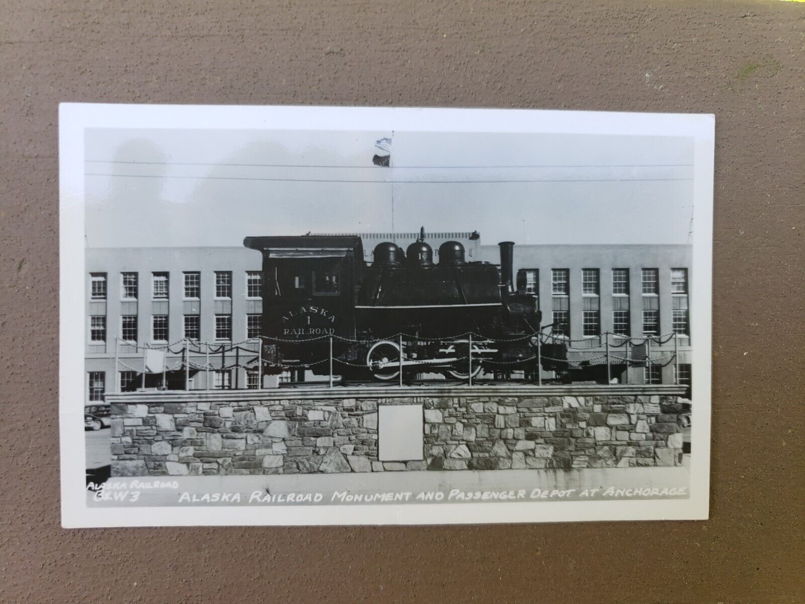 Alaska Railroad Monument & Passenger depot Anchorage Real Photo  Postcard