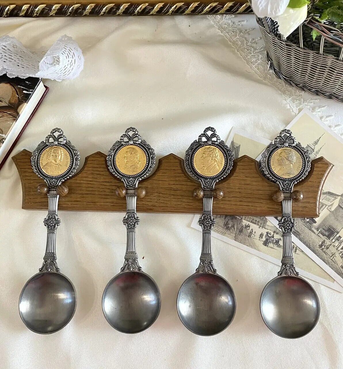Vintage Set of four large pewter spoons on a collectible wooden pewter hanger