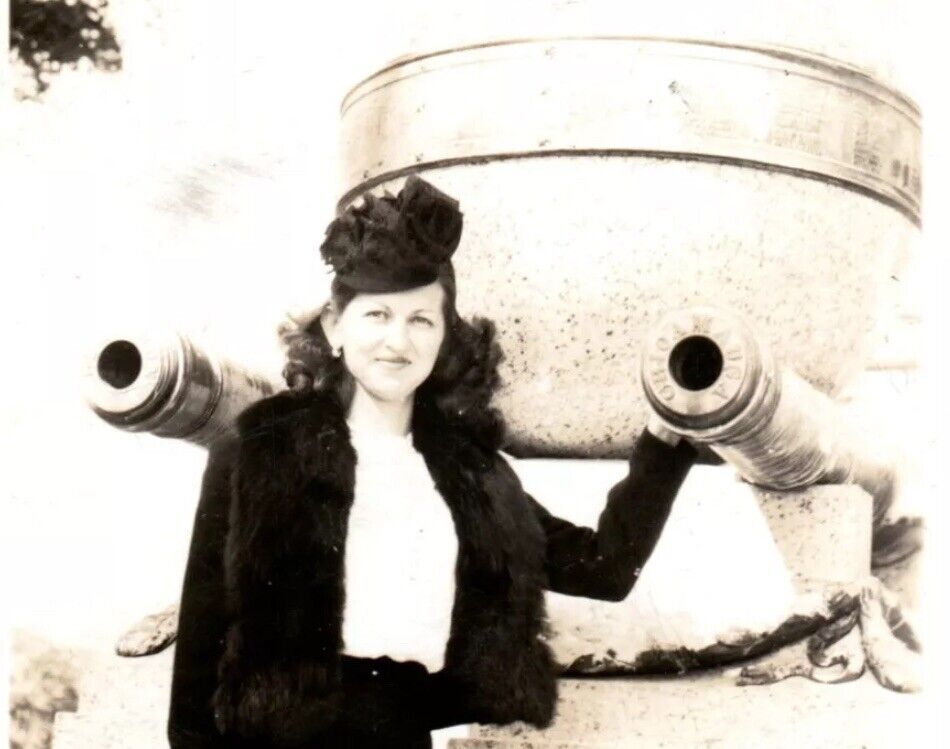 Late 1940s Woman Standing in Front of Tank Canon Wearing All Black Vintage Photo