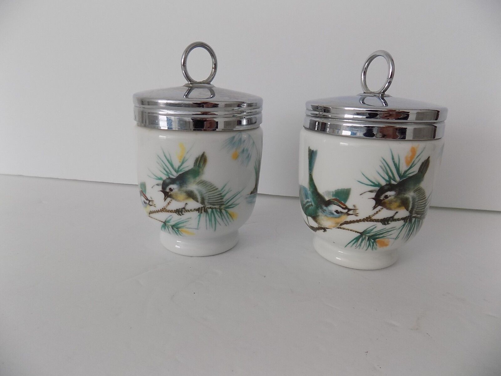 Pair of Royal Worcester egg coddlers with birds Made in England
