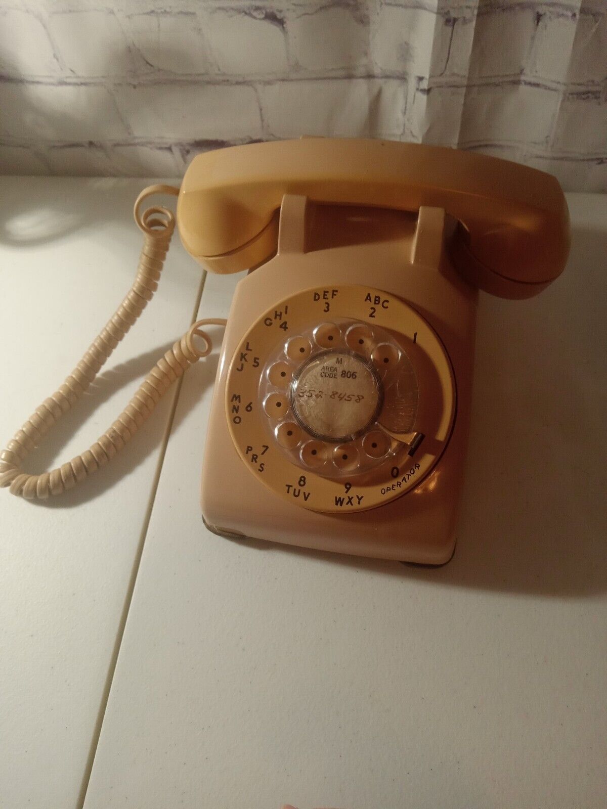 Vintage rotary phone, dark beige