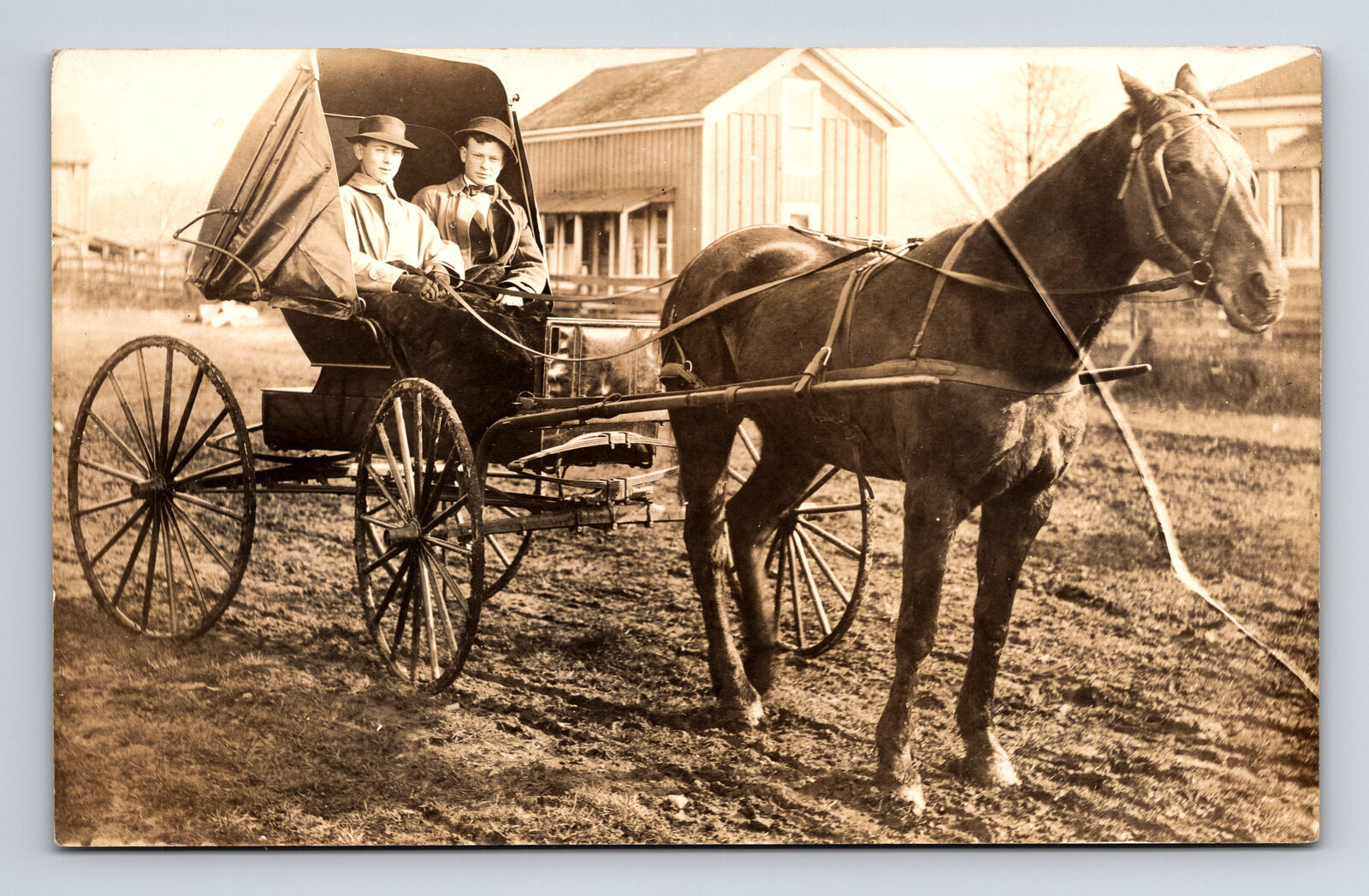 RPPC Two Young Men in Horse Drawn Buggy Carriage on Dirt Road Farms Postcard