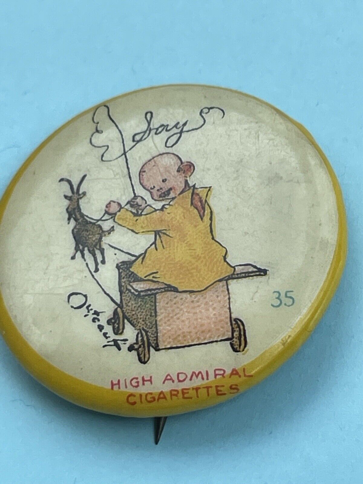 1896 Vintage High Admiral Cigarettes pin back button yellow kid