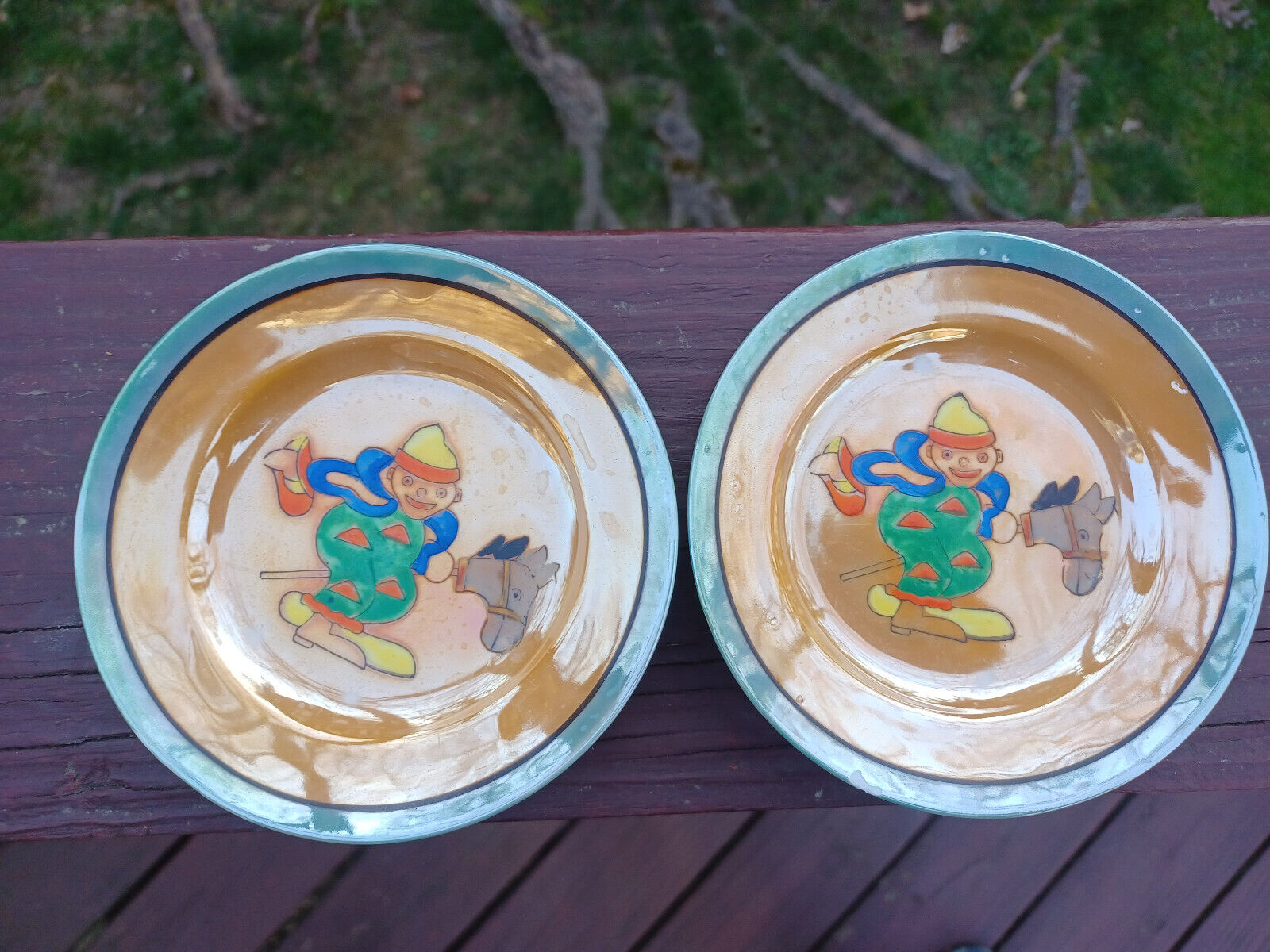 ⭕️ Two Antique European Saucer Plates, early 1940\'s, Clown riding a horse stick