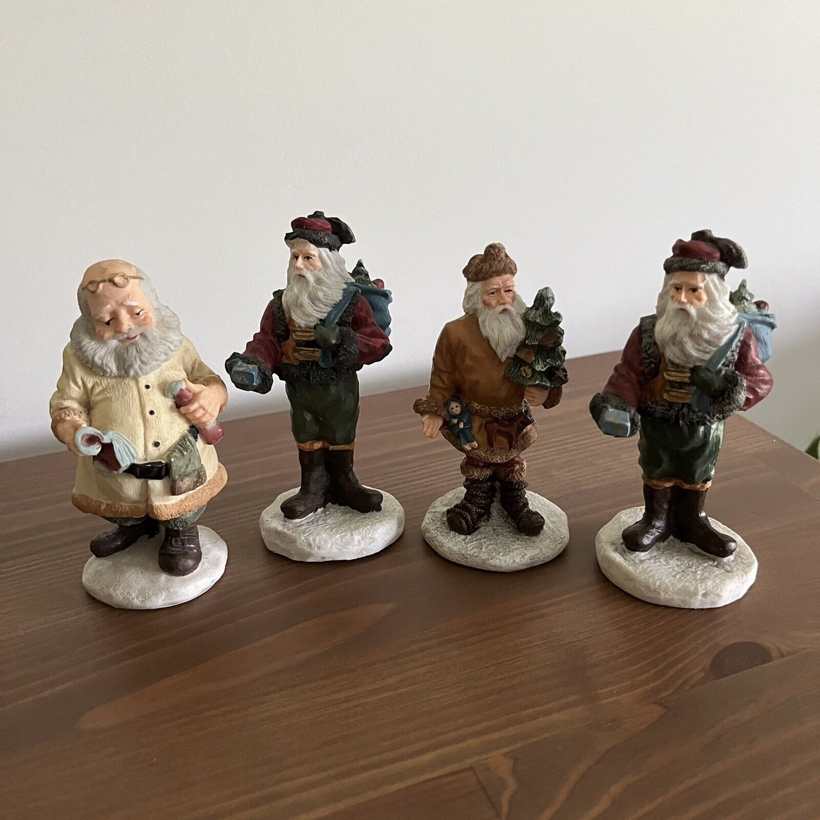 Lot Of 4 Christmas Painted Figurines 