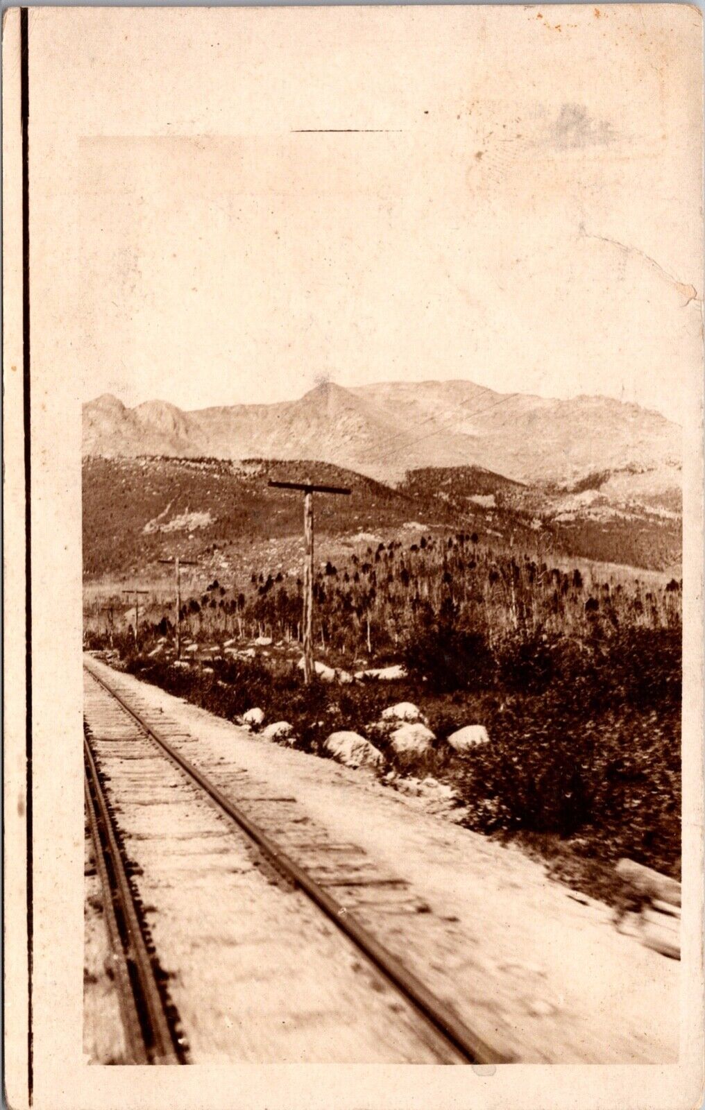 Real Photo Postcard Railroad Train Tracks and Landscape in/near Des Moines Iowa