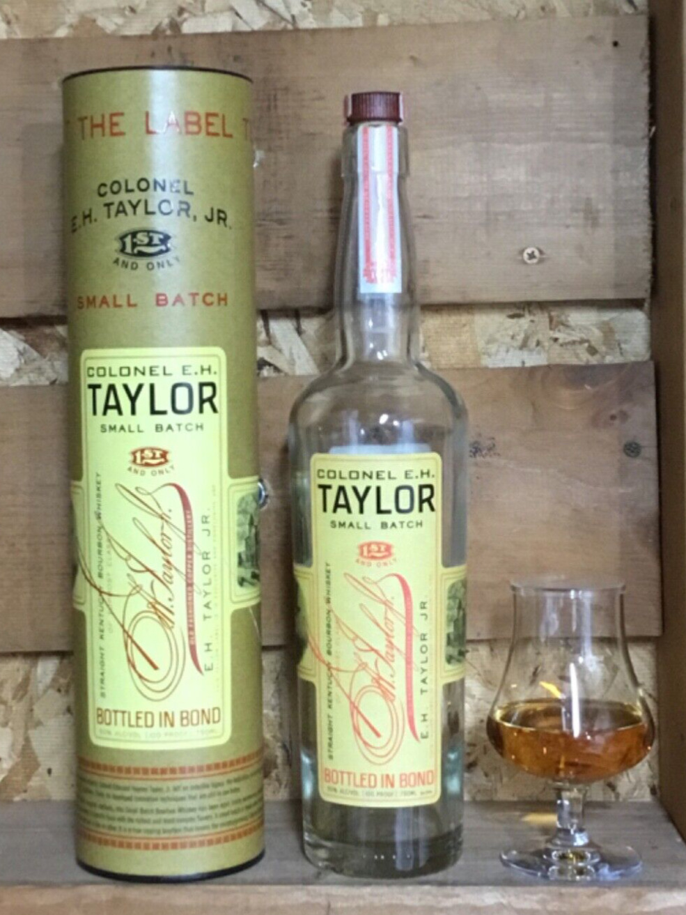 Empty E.H. Taylor Kentucky bourbon whiskey bottle and tube