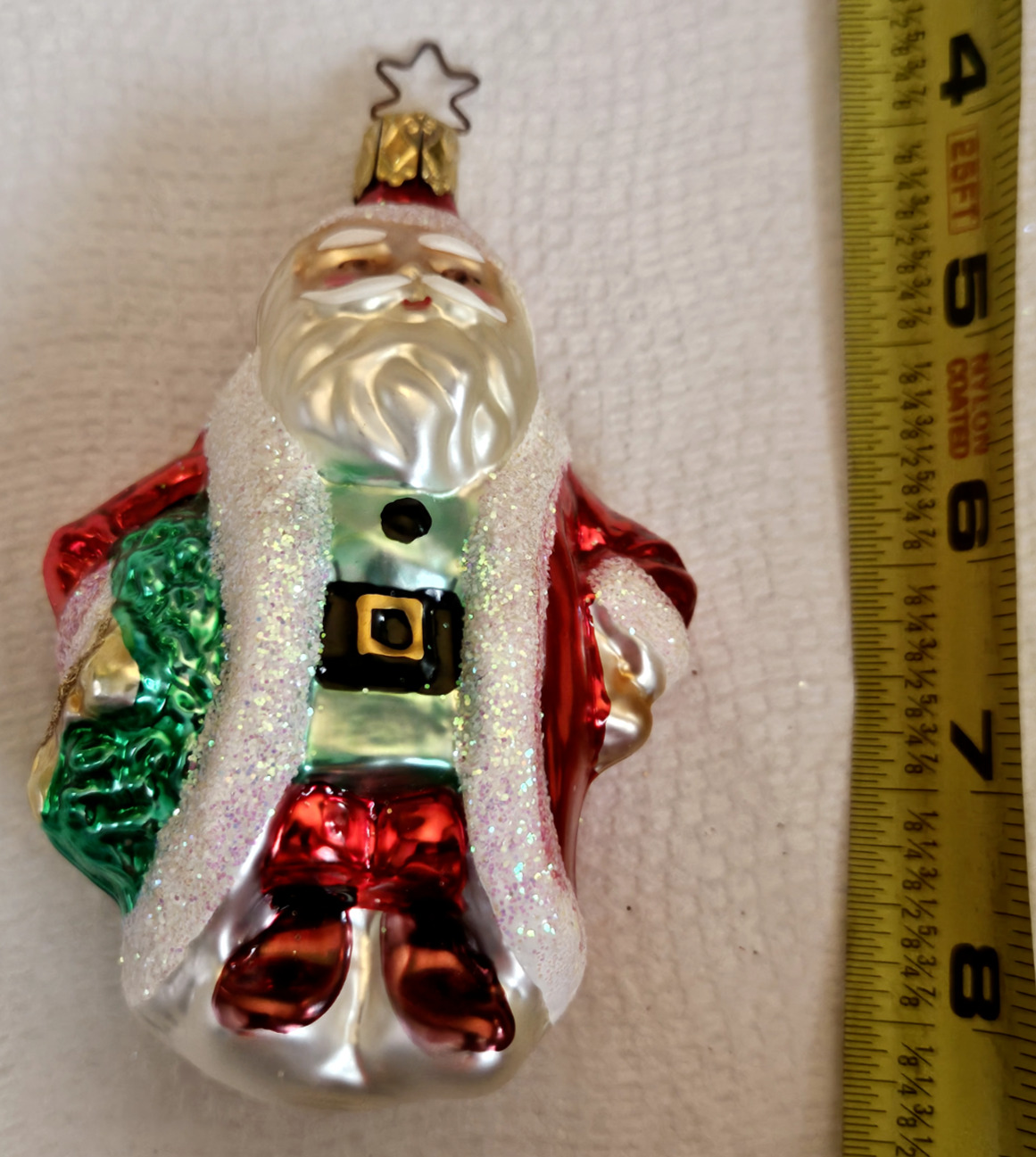 The Merck Family’s Old World Christmas Glass Ornament Santa\