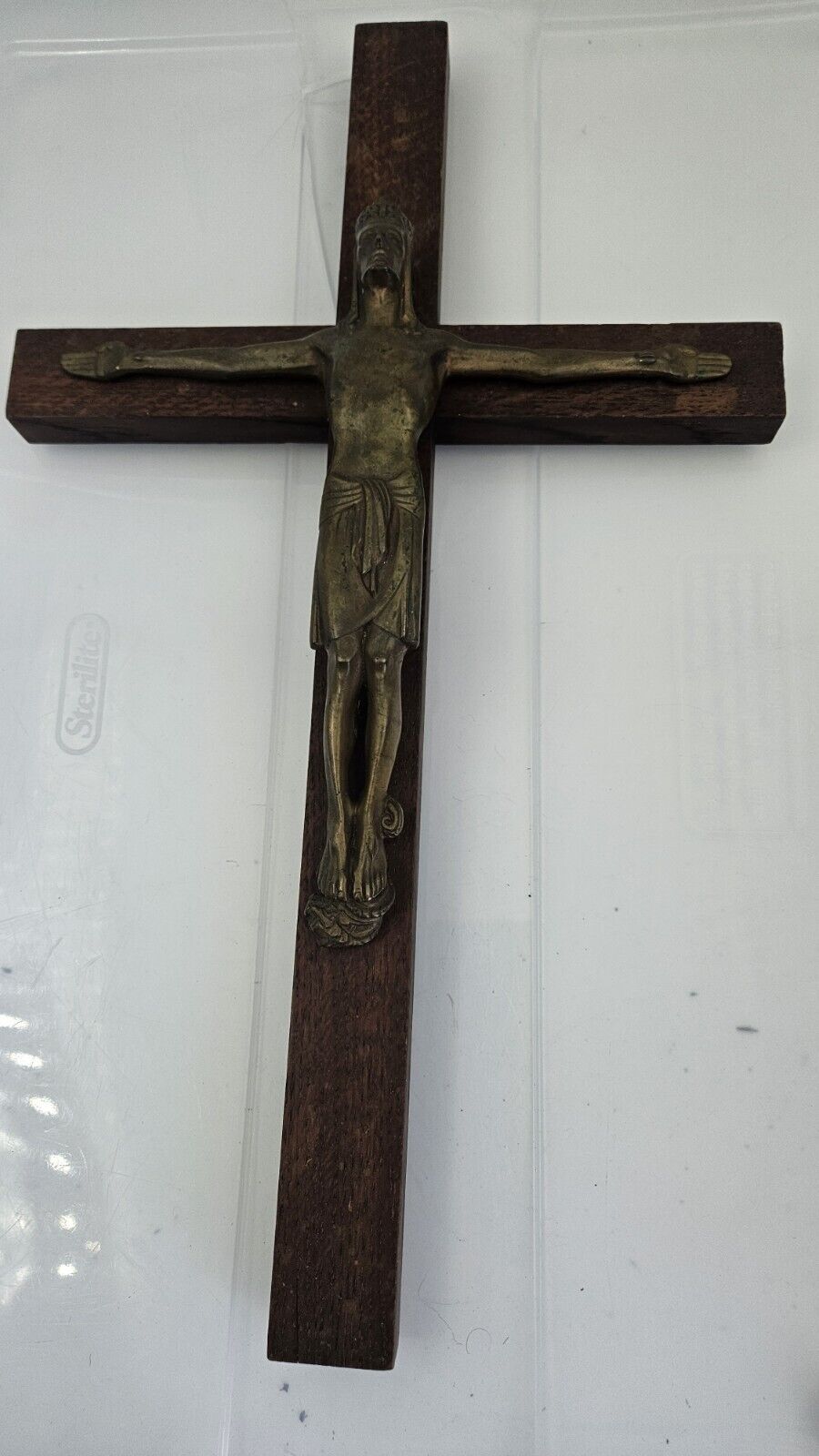 old vintage wooden cross with crucified Jesus in bronze