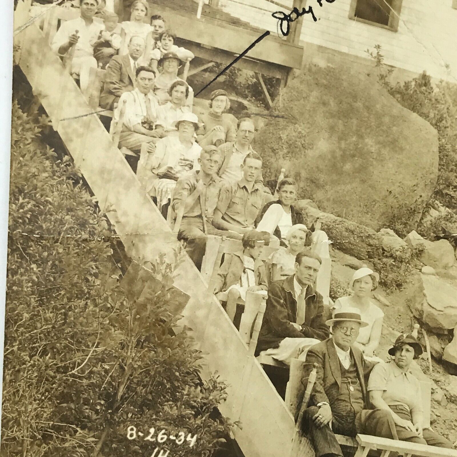 Vintage 1934 Sepia RPPC Real Photo Postcard People Sitting Wooden Ride Hill