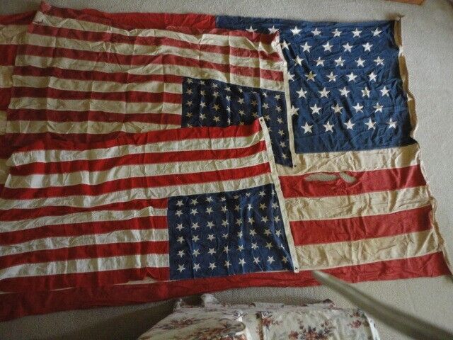 49 star flag, large, and two smaller 48 star U.S. flags