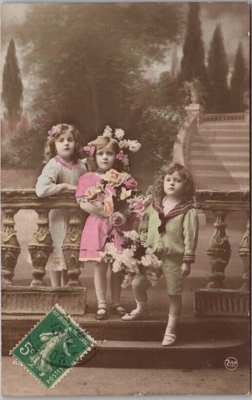 c1900s European RPPC Greetings Postcard 3 Kids / Roses - Hand-Colored Photo