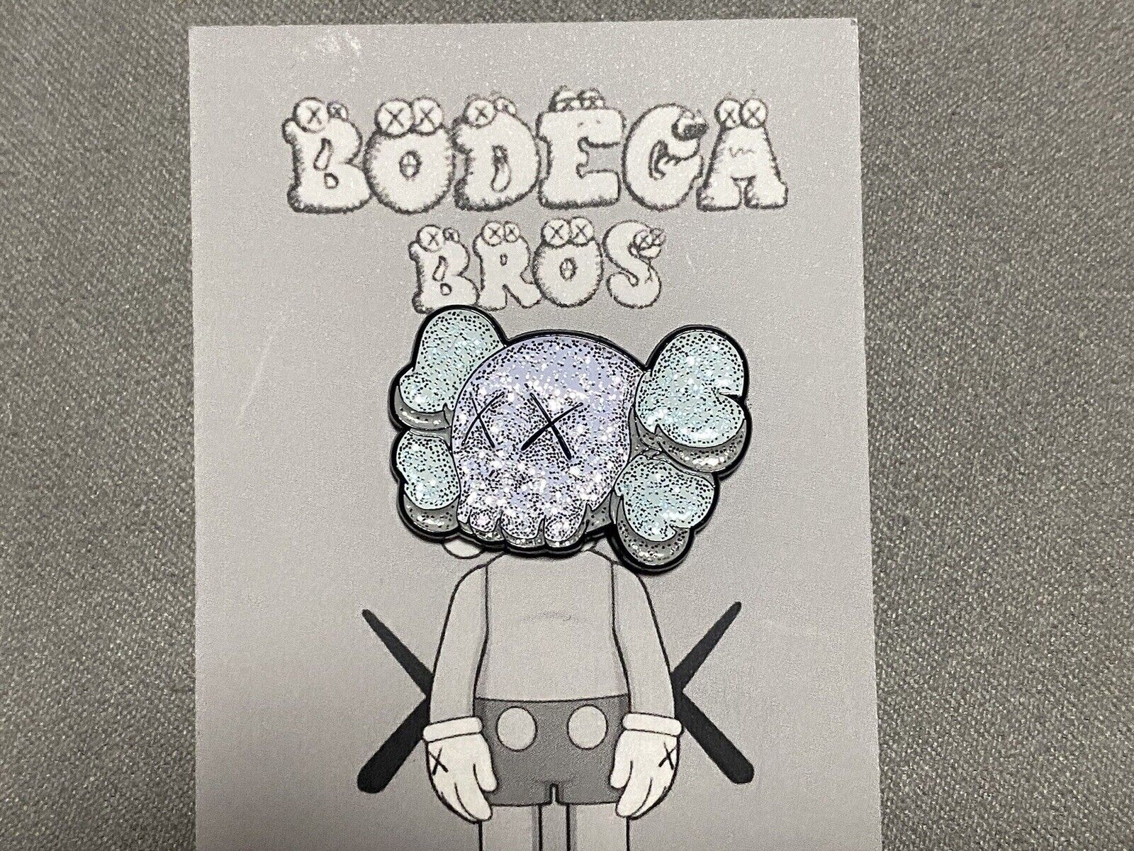Bodega Bros KAWS Companion Head Gray Silver Hat Pin Limited Edition Glitter