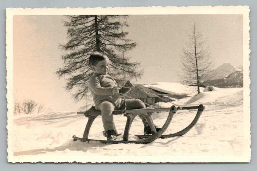Chubby Toddler Boy on Snow Sleigh RPPC Cortina d\'Ampezzo Italian Alps Photo ~50s