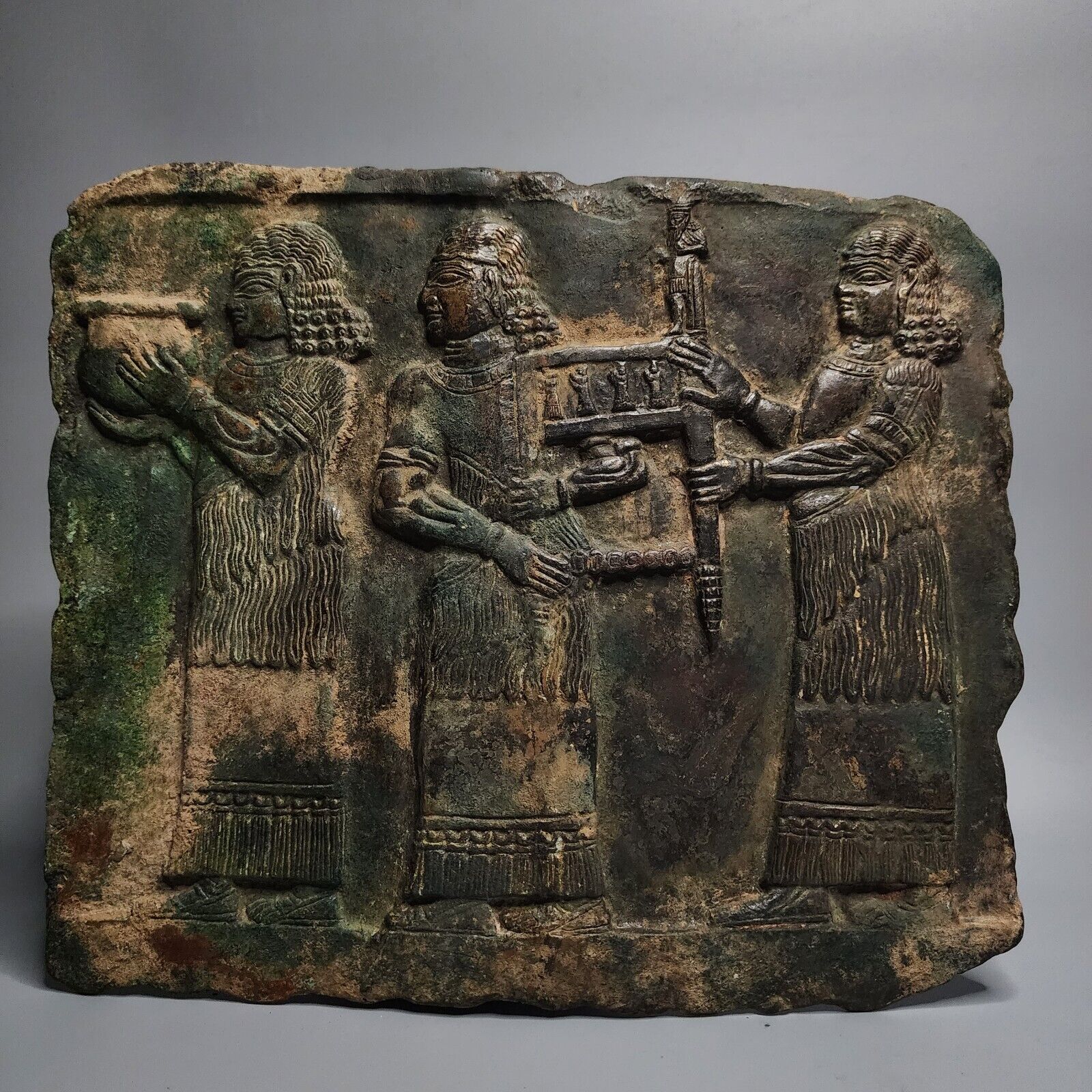 CIRCA AN IMPORTANT SUMERIAN BRONZE PLATE WITH FEMALE WORSHIPPERS.