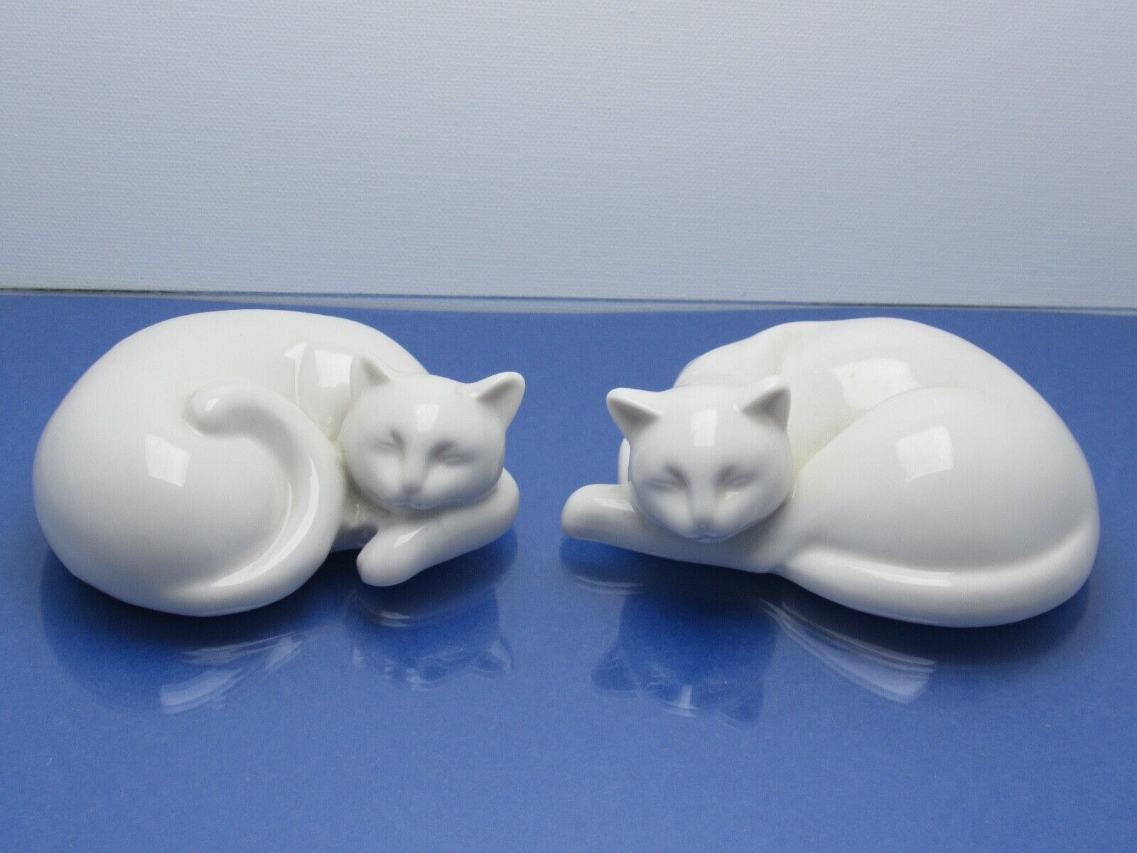 Elegant Pair of White Porcelain Sleeping Cat Figurines