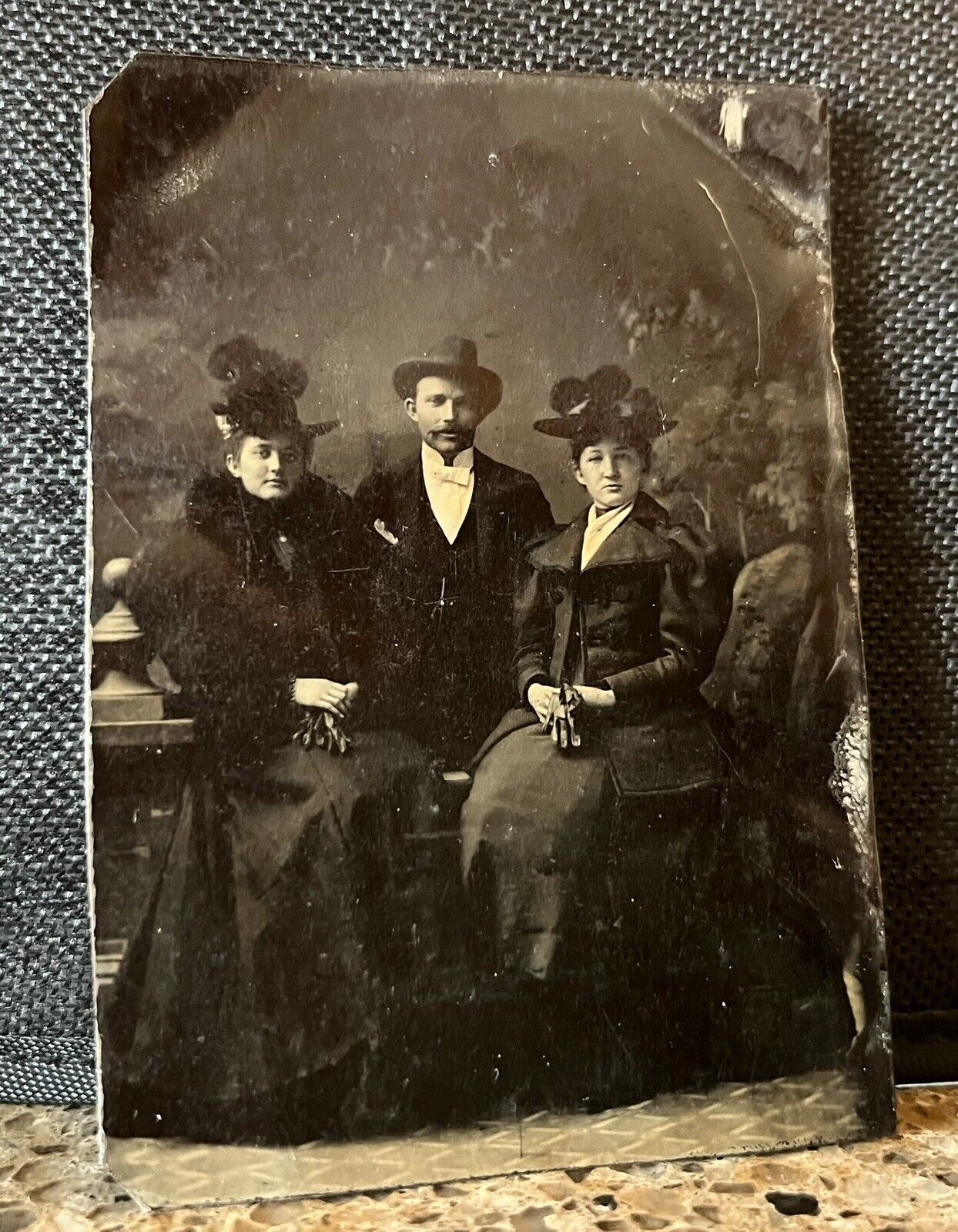 Antique Tintype Photograph Man and Two Women Seated Gloves On Lap Fancy Hats