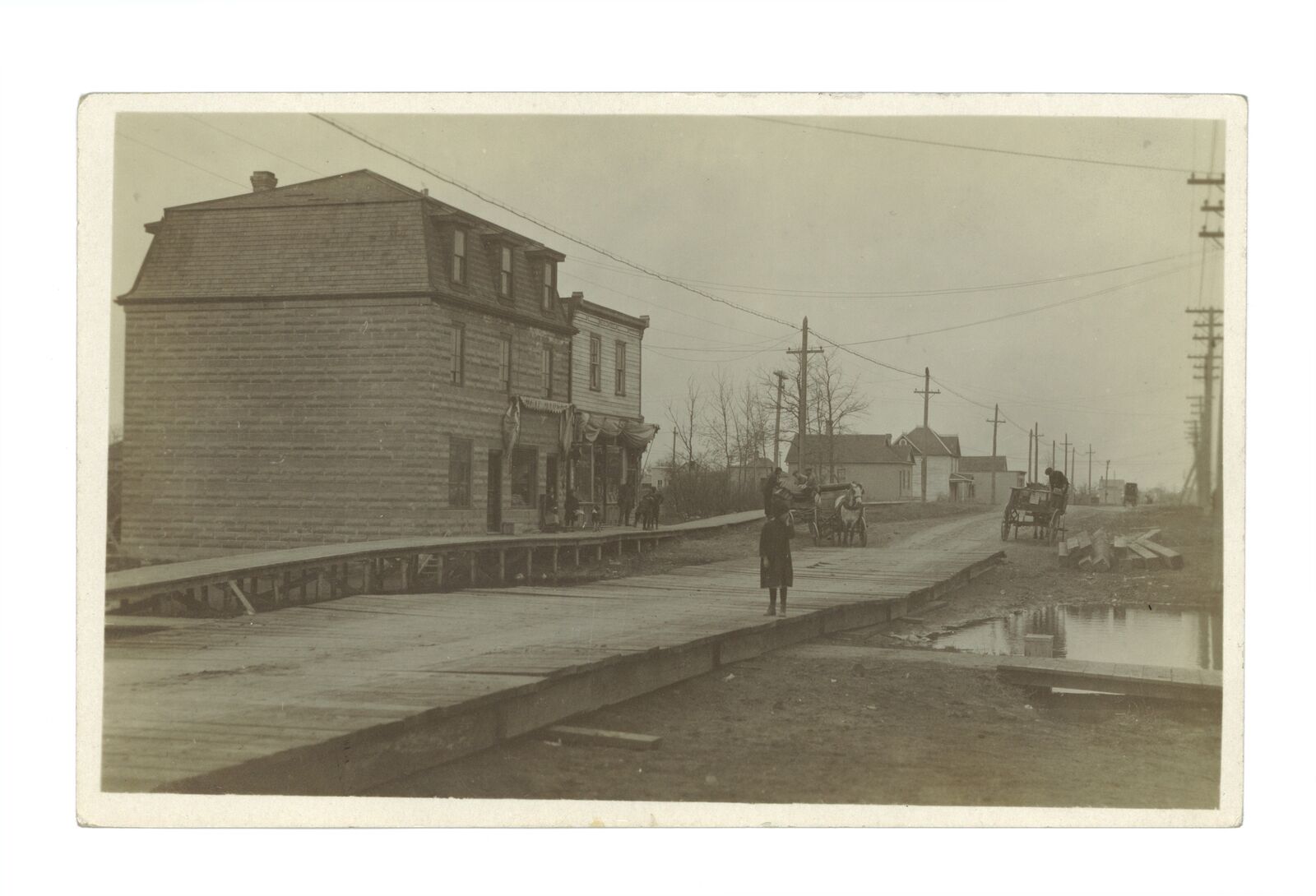 Residential street - A street in Winnipeg showing a wooden walking- Old Photo
