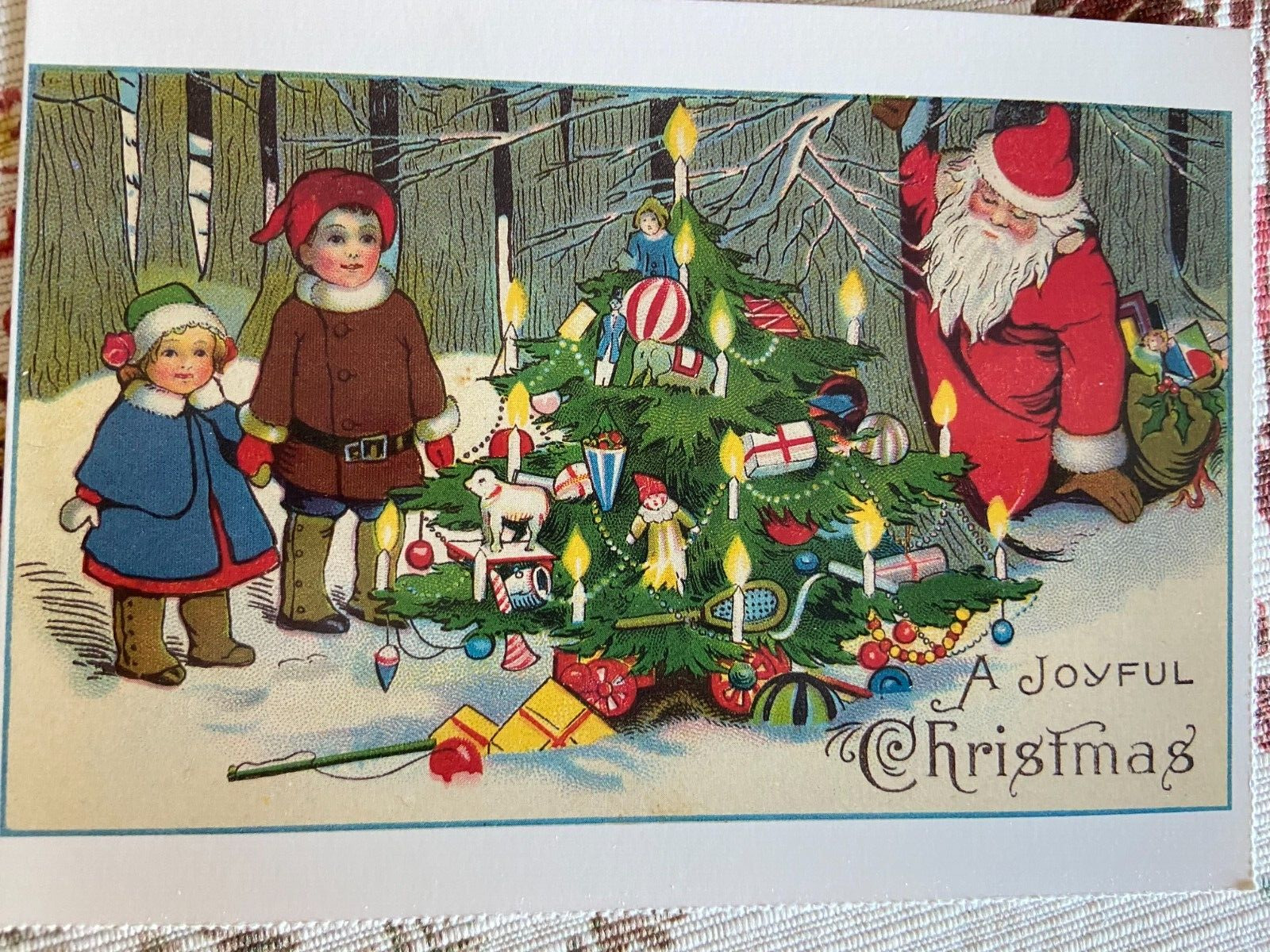 vintage Christmas postcard joyful children Santa tree ornaments snow reproduced