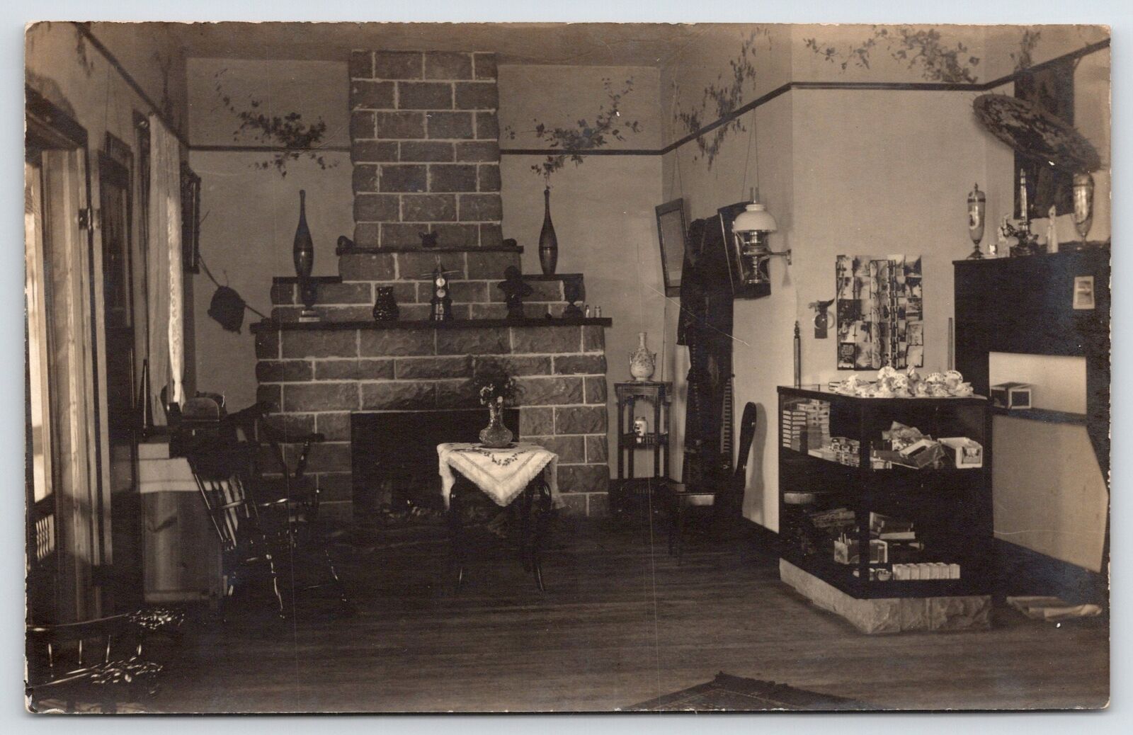 RPPC Red Brick Fireplace~Gift? Shop Interior~Rocking Chair~Oriental Hat~Vases PC