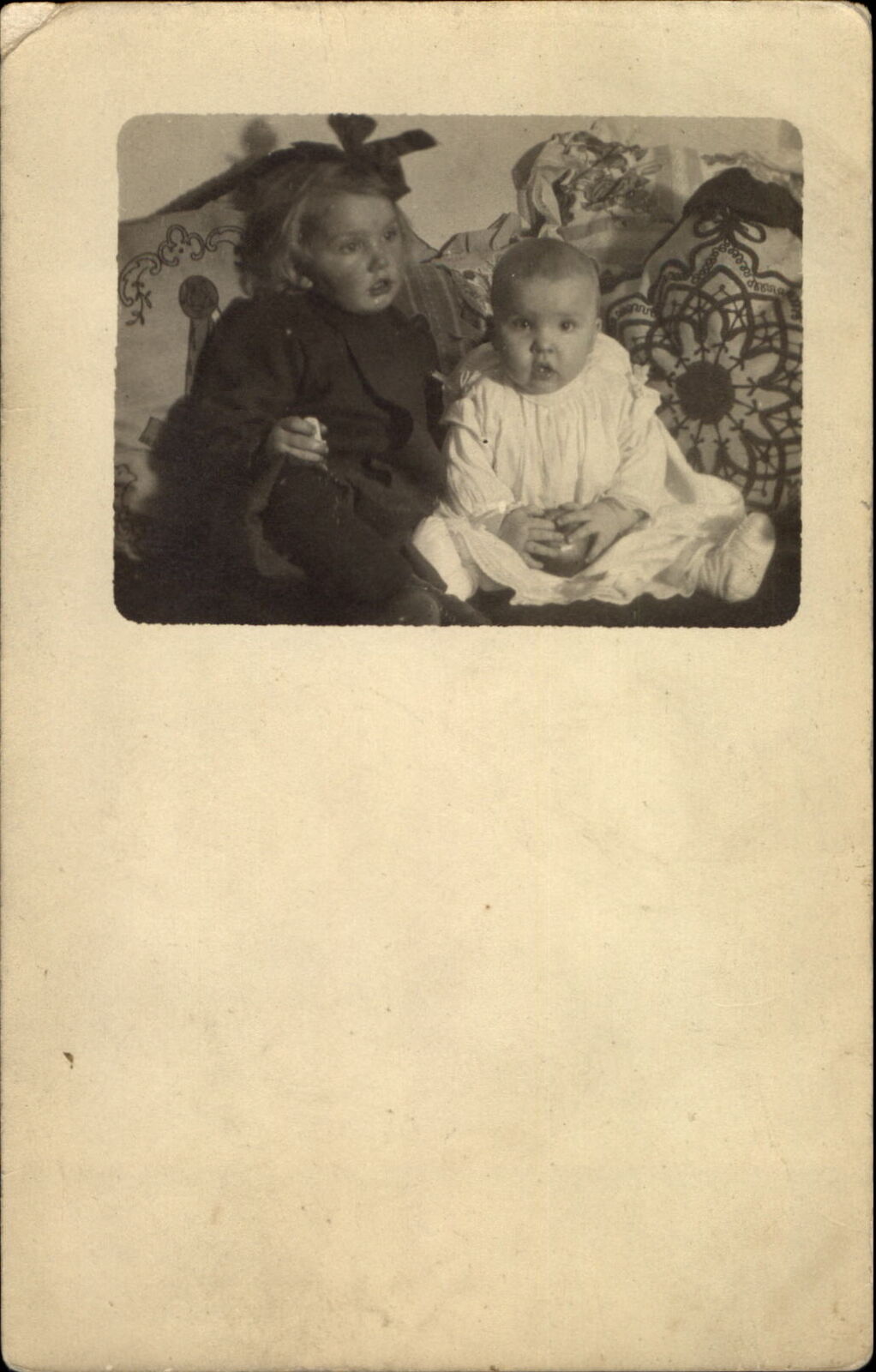 RPPC Kids on couch dazed look toy ball~ 1910 ESSIE ABEL to ELLA BUCK Goodhue MN