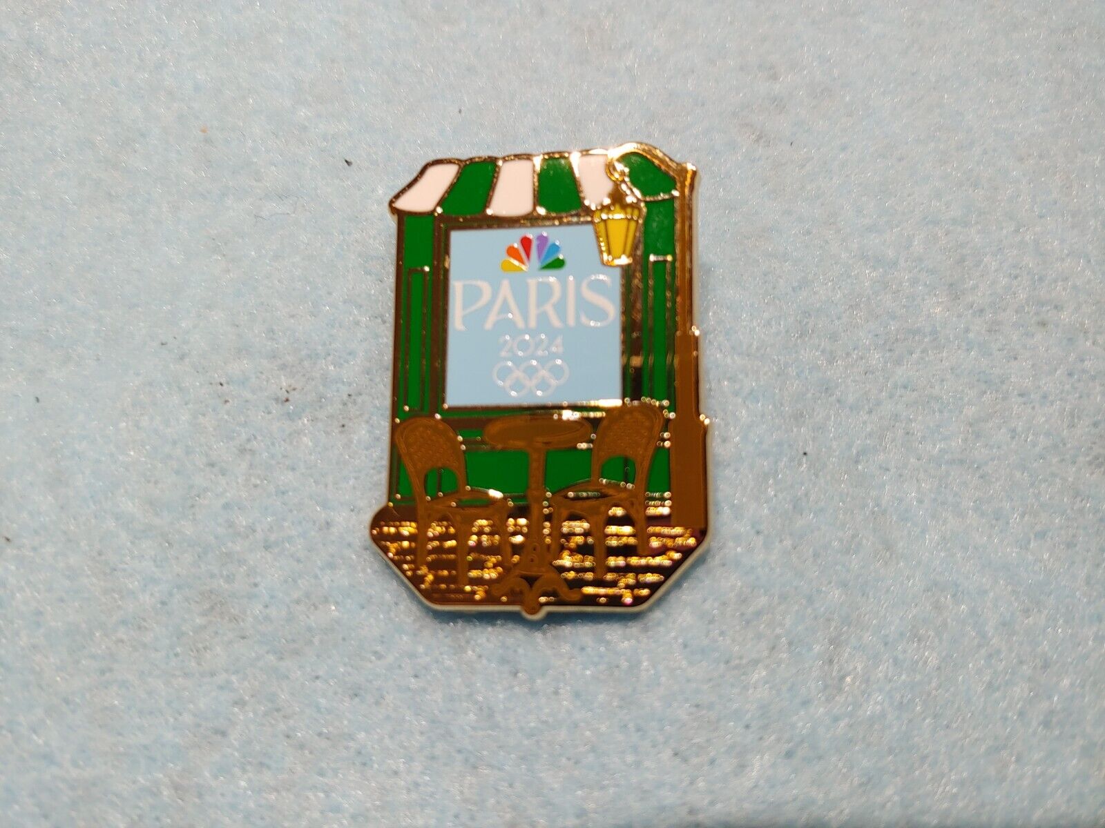 NBC 2024 Paris Summer Olympics Cafe Bistro Lapel Gold-Tone Pin NEW IN PACKAGE