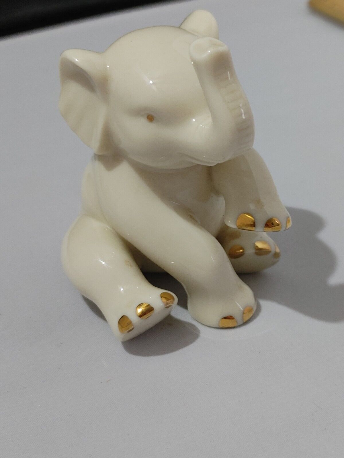 Lenox Baby Elephant Porcelain Figurine 24k Gold trim sitting w/raised trunk