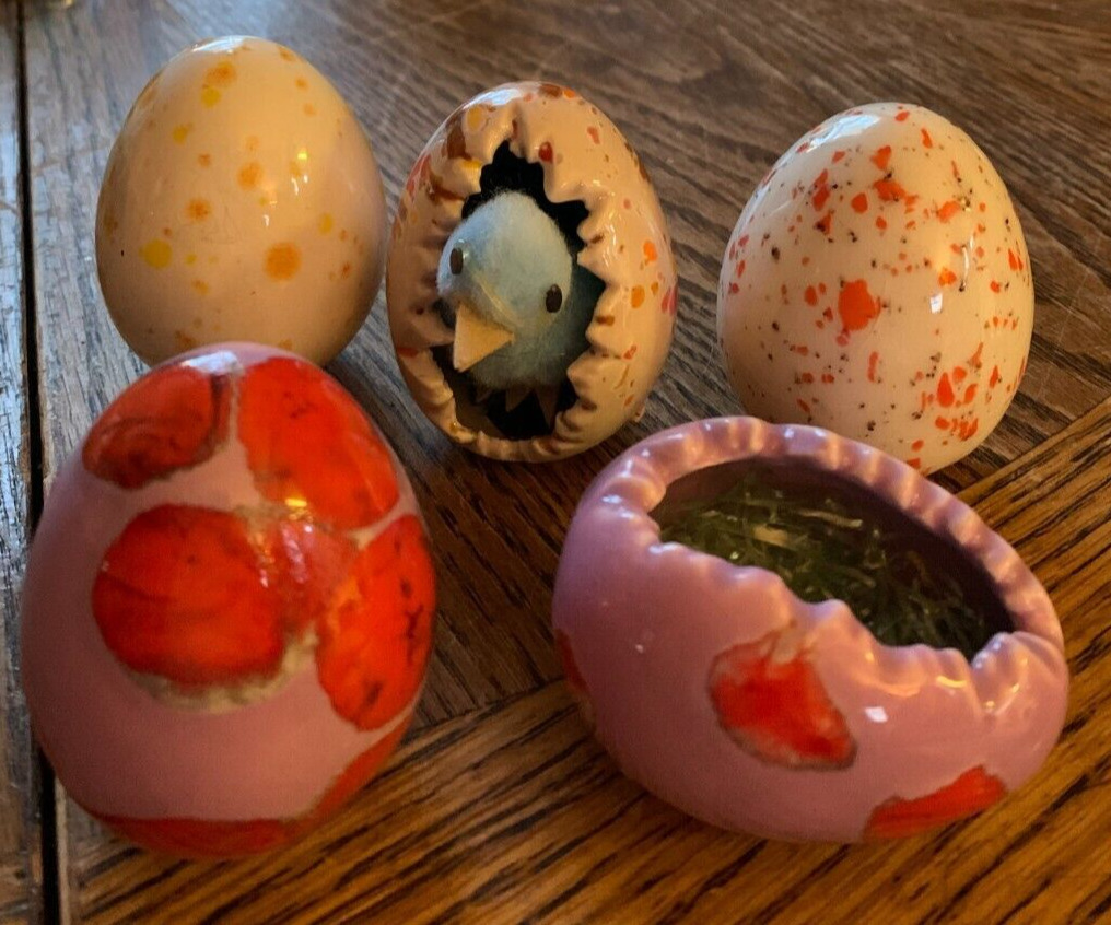 Five Easter egg decorations one has baby chick inside
