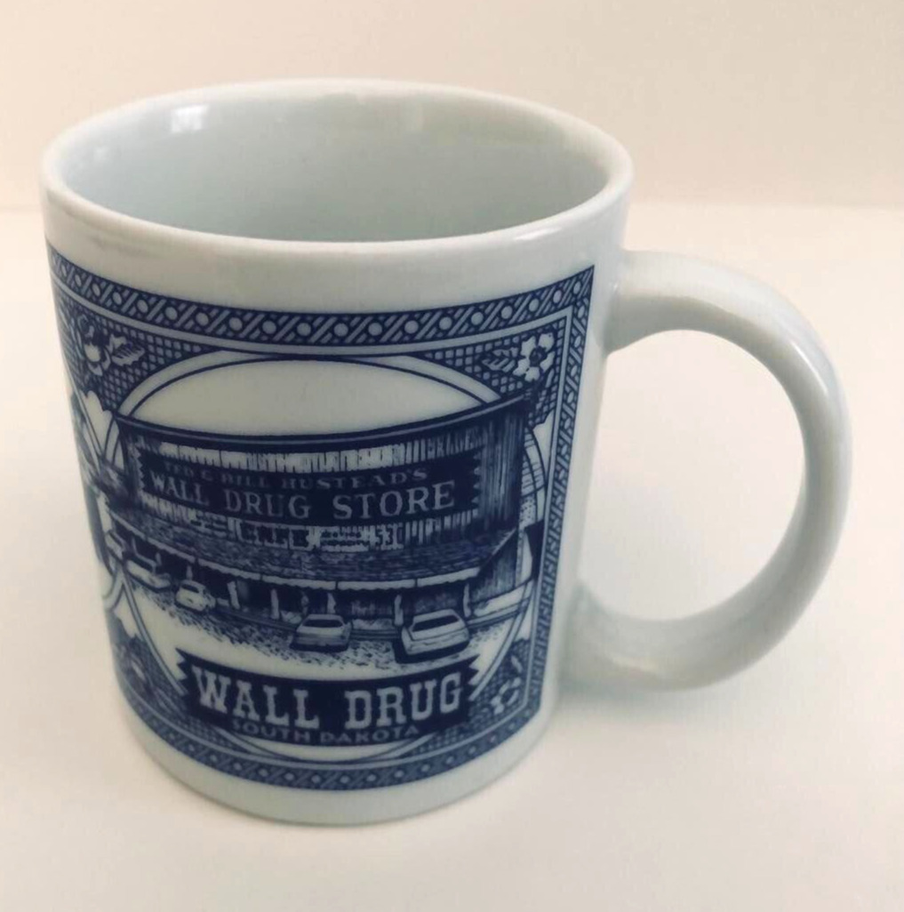 South Dakota Souvenir Wall Drug Store Coffee Mug Blue & White T-Rex Cowboy
