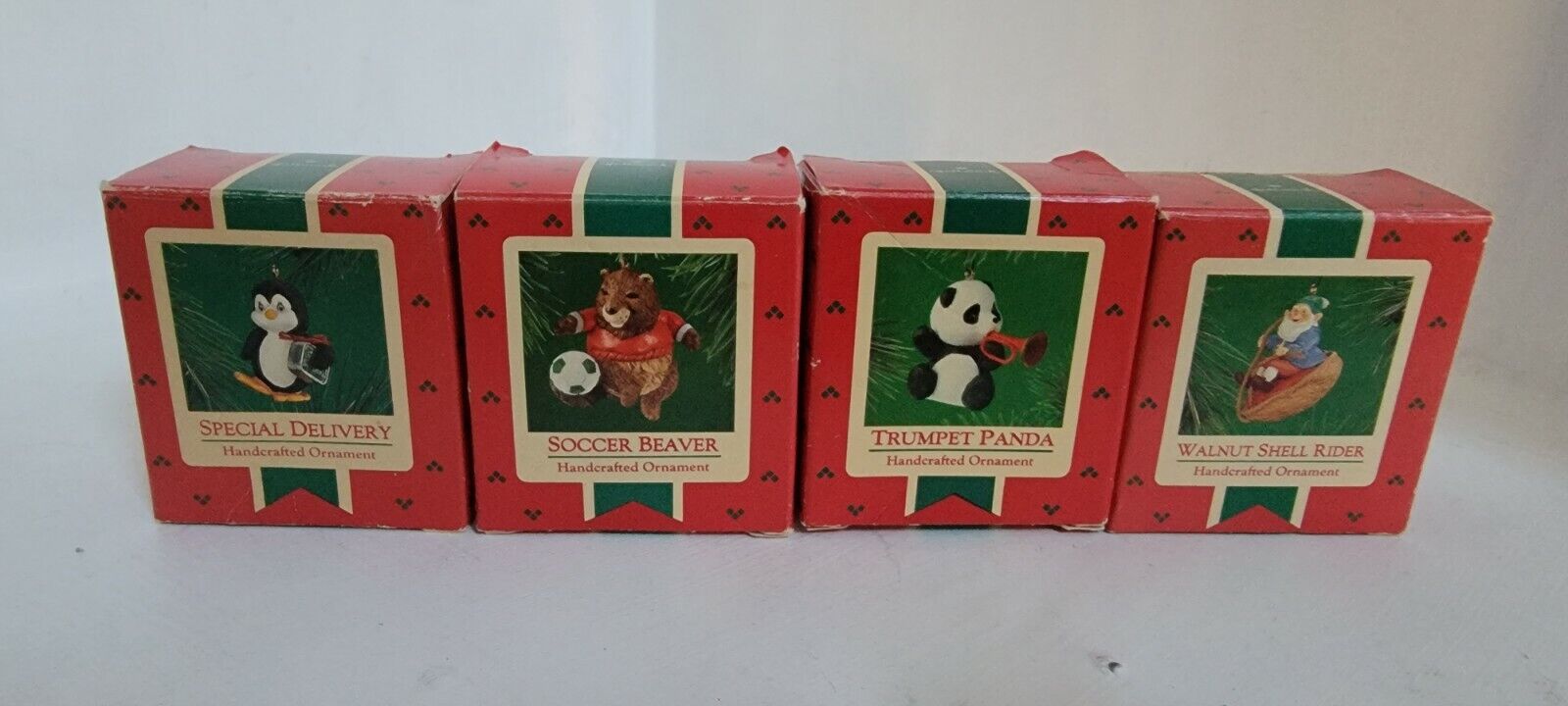 Lot of 4 Vintage Hallmark Ornaments - panda , beaver , special delivery, walnut