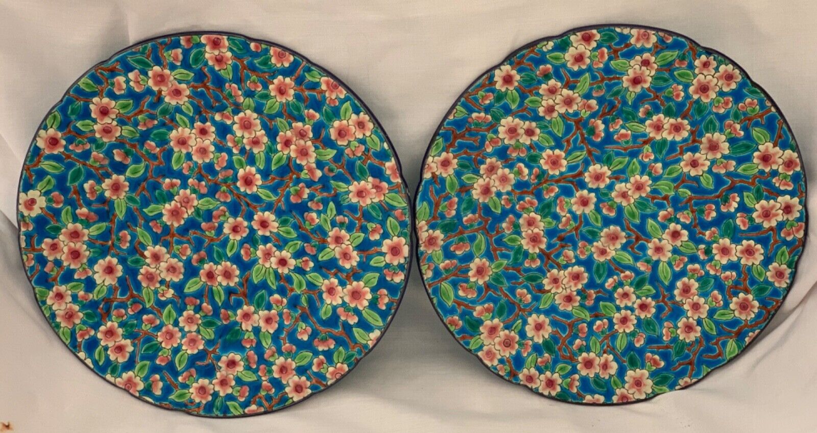 Rare antique pair of Longwy plates decorated in cloisonné style with spring blos