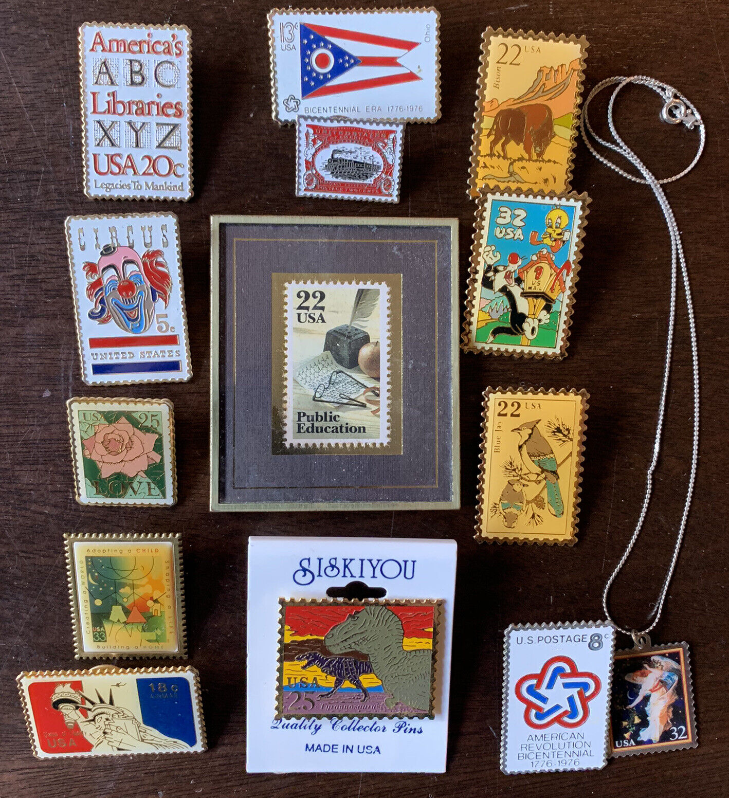 STAMPS PINS AND NECKLACE COLLECTION. PUBLIC EDUCATION STAMP IS NUMBERED ON BACK