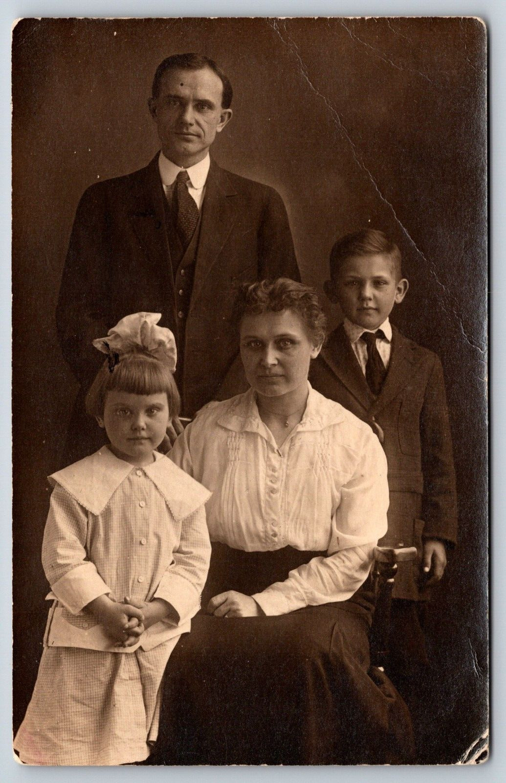Family Posing In A Studio Real Photo Vintage Postcard