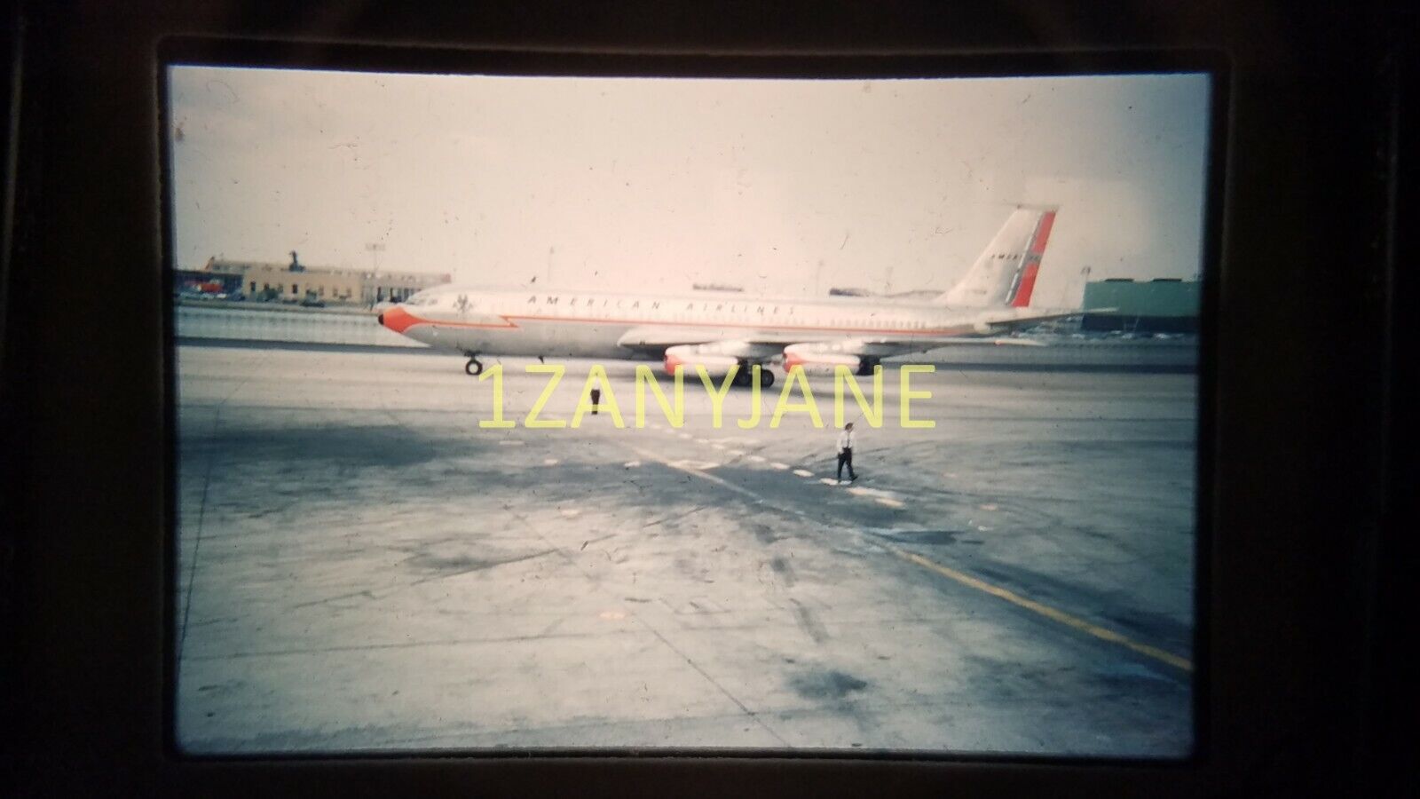 AZ12 VINTAGE 35mm SLIDE Photo AIRPLANE PARKED ON RUNWAY WITH PILOT WALKING AWAY