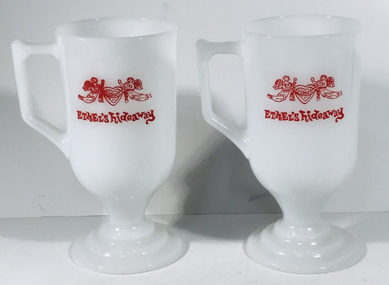 Two (2) Vintage Ethel’s Hideaway Palm Springs Pedestal Milk Glass Cup Mug