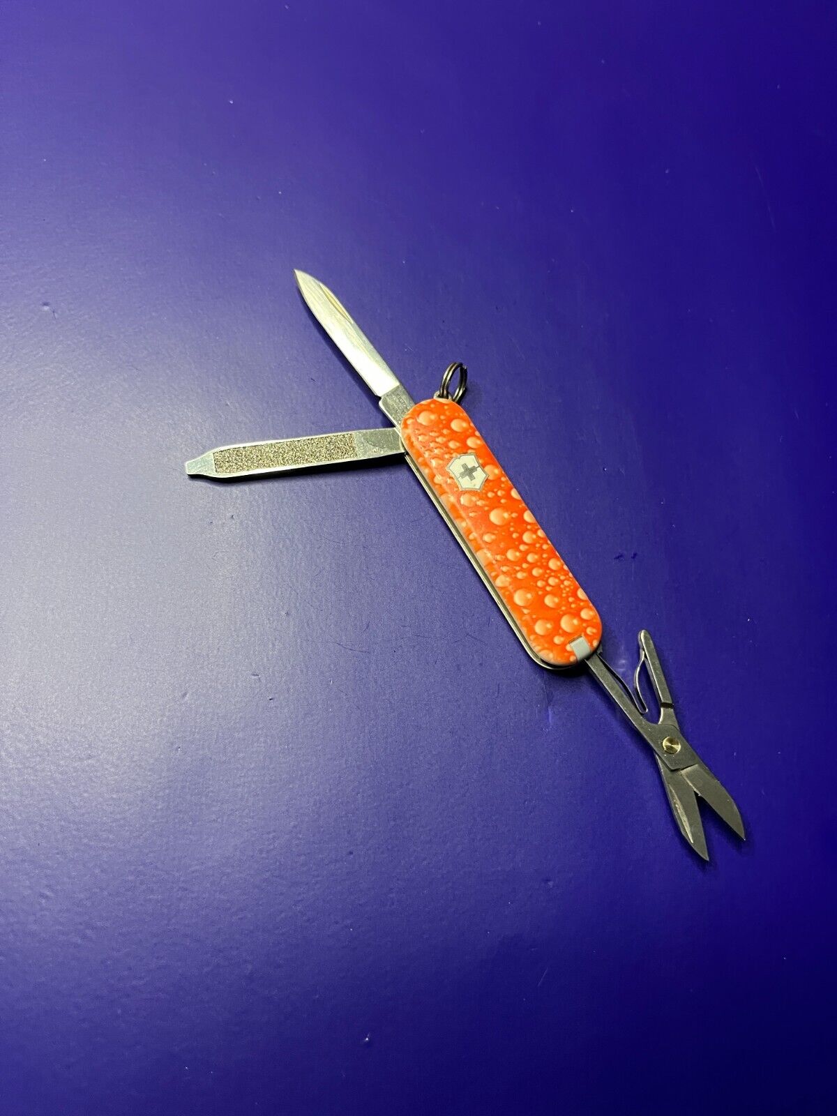 Victorinox Classic SD Swiss Army Knife. Orange Bubbles 3D Textured Pattern
