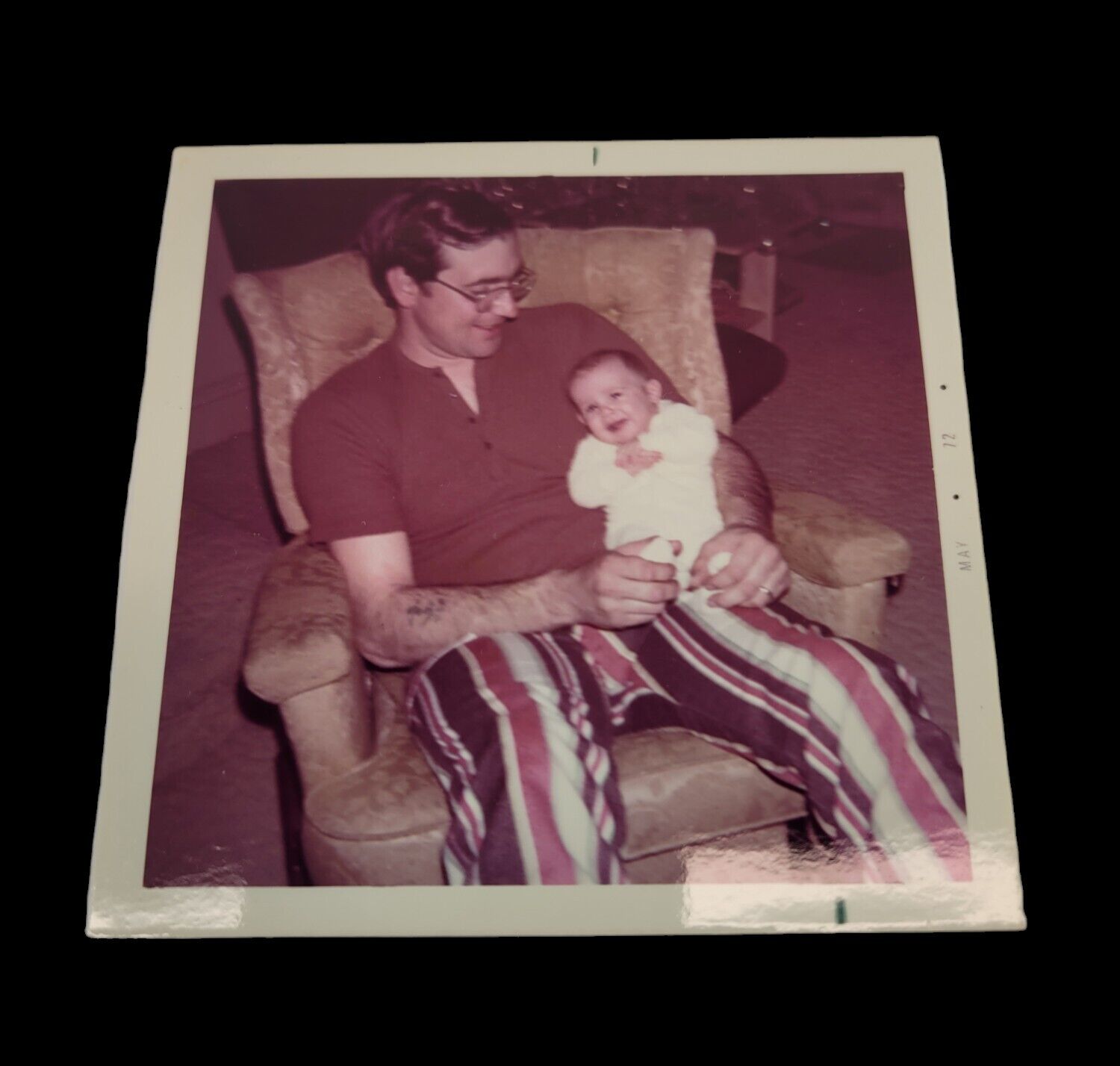 1970s Photo Color Vintage Snapshot Hippie Dad holding baby in recliner chair