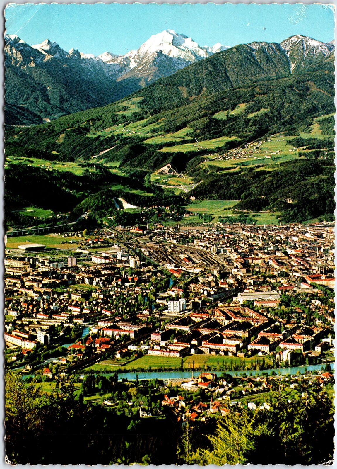 VINTAGE CONTINENTAL SIZE POSTCARD AUSTRIAN ALPS AND INNSBRUCK IN VALLEY 1972
