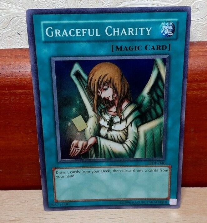 Graceful Charity Super rare Yu-Gi-Oh card. SDP-040. Magic type. Konami.