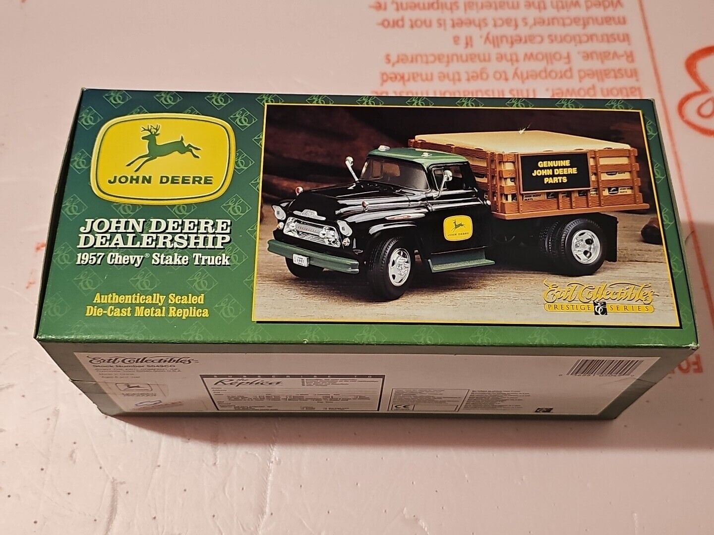 Vintage John Deere 1957 toy Chevy stake truck.