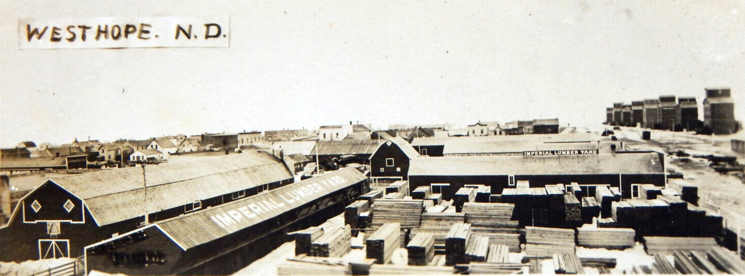 RPPC WESTHOPE N.D. IMPERIAL LUMBER YARD TOWN VIEW 1910s PHOTO POSTCARD UNPOSTED