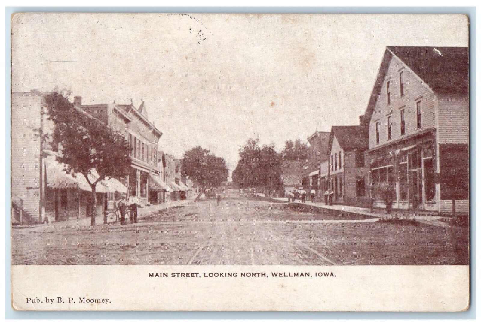 1910 Main Street Looking North Exterior Building Road Wellman Iowa IA Postcard