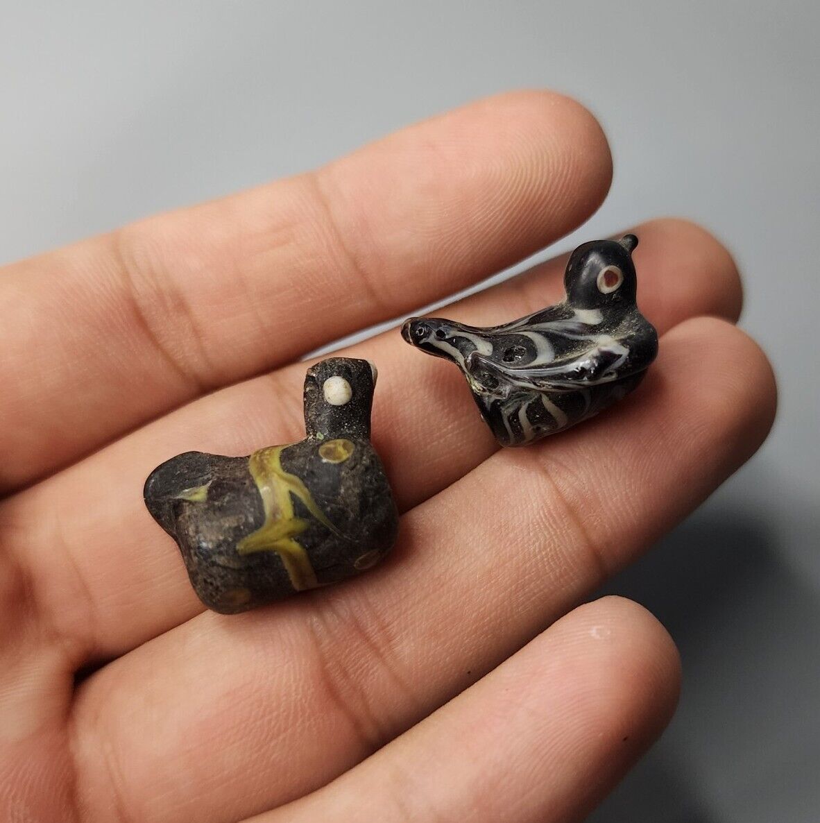 CIRCA BEAUTIFUL 2PC PHOENICIAN GLASS BEAD IN THE FORM OF A DUCK.