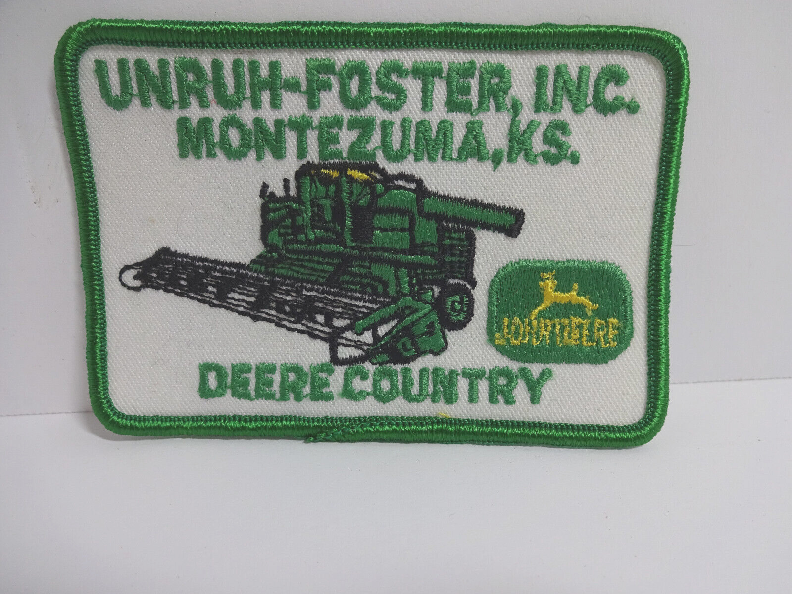 Vintage John Deere patch Unruh-Foster INC. Montezuma KS Deere County 4x2.5\