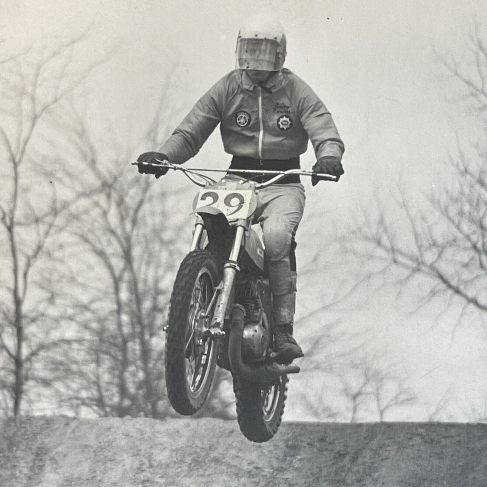 dirt bike motorcycle jumping mud vintage photograph