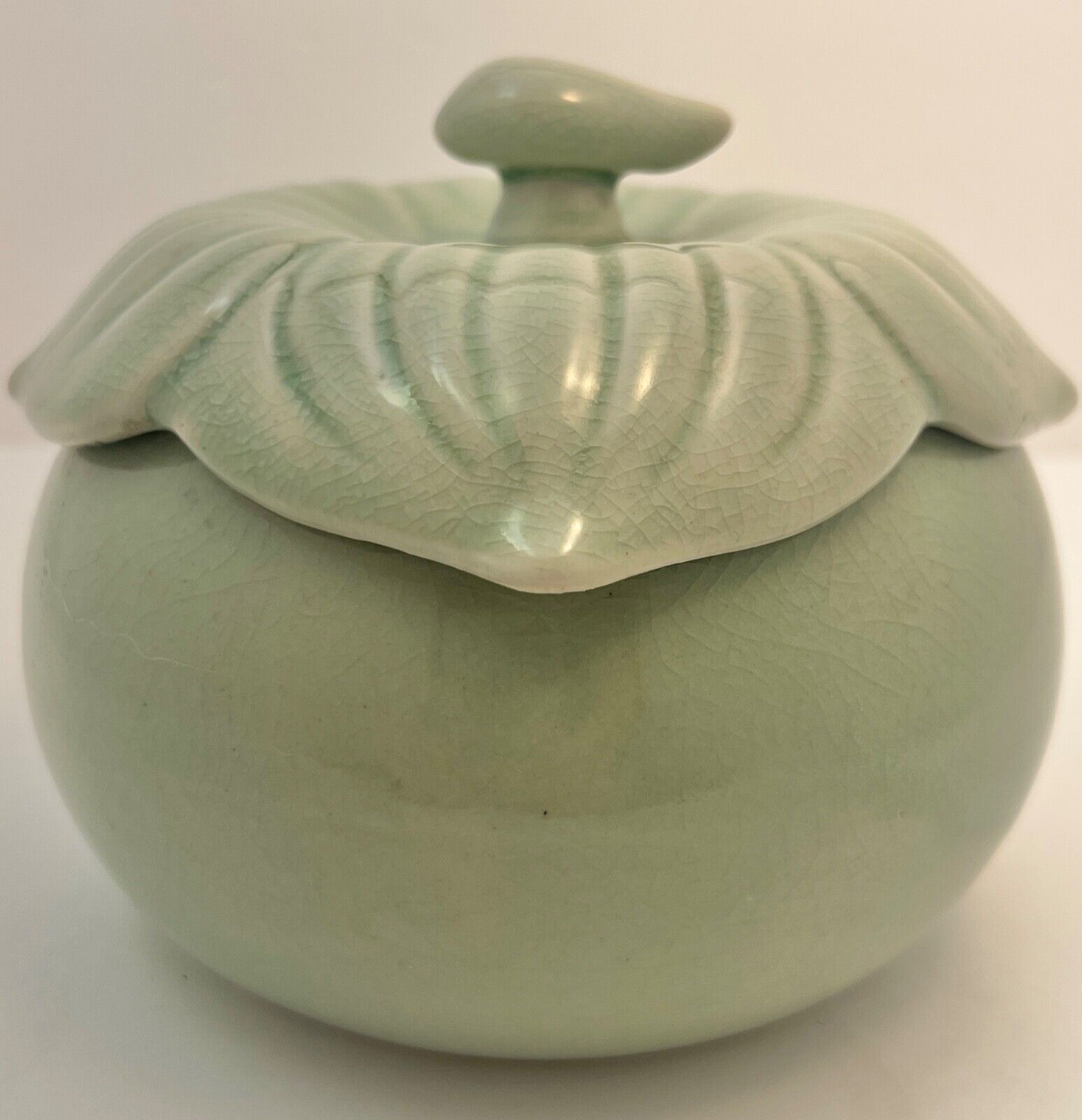 Celadon Lidded Round Jar With Leaf Design Lid with Little Stem Handle