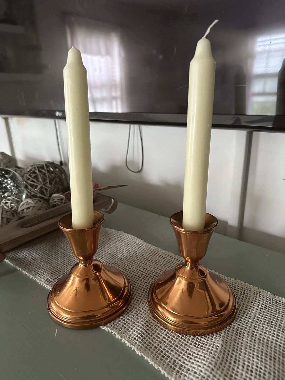 A Pair Of Copper Candle Holders