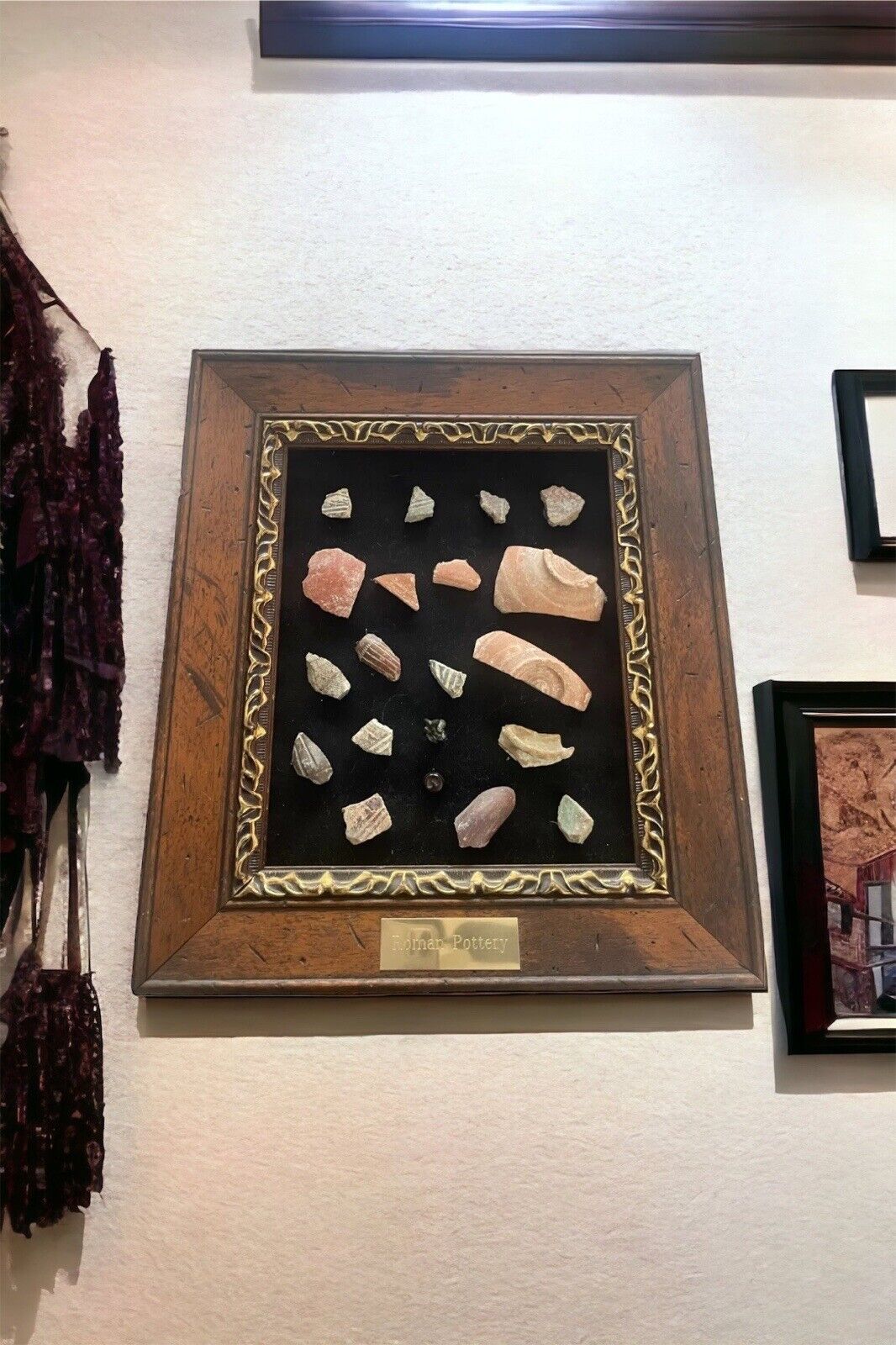 A framed group of Roman pottery fragments