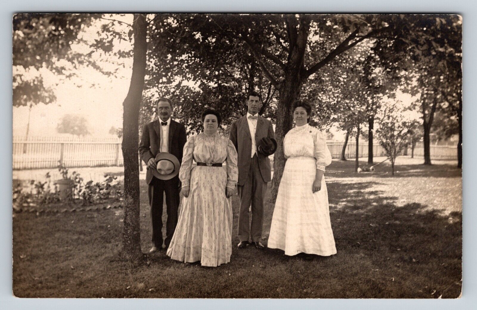 RPPC Couples Stand Together Dressed Nicely ANTIQUE Postcard AZO 1904-1918