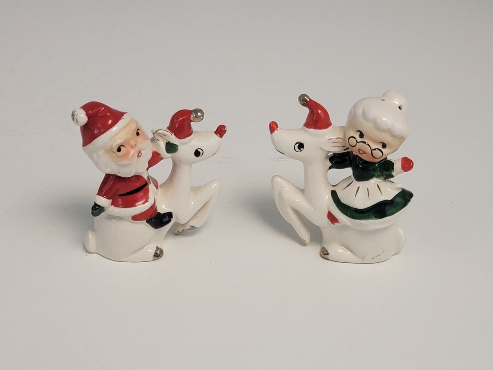 Vintage Christmas Salt and Pepper Shakers Santa and Mrs. Clause Riding Reindeer